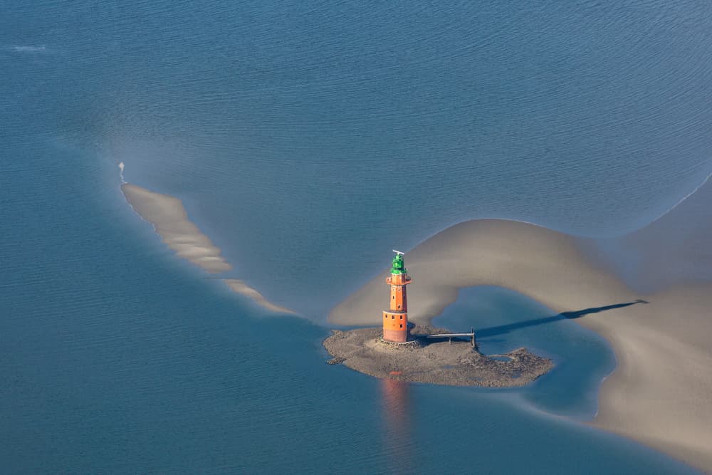 Orange Lighthouse on Sand by Andreas Klesse — canvas wall art