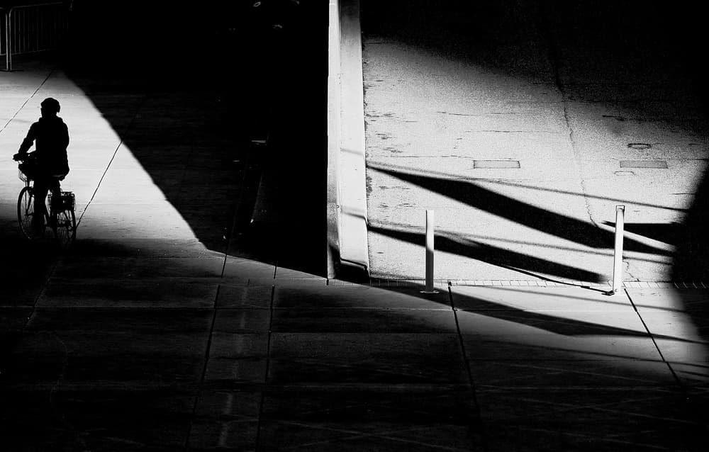 Urban Shadow Cyclist by Jian Wang — canvas wall art