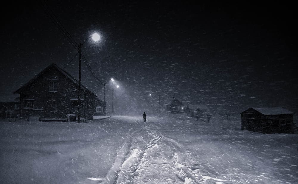 Lone Figure Snowfall by Mette Caroline Strøksnes — canvas wall art