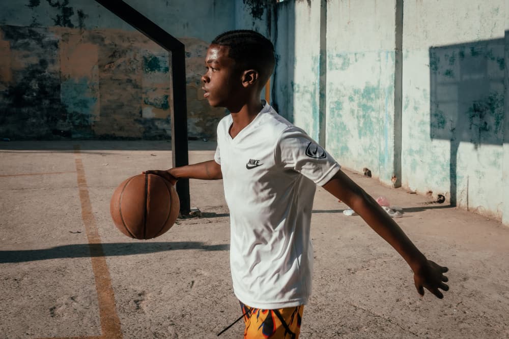Boy Dribbling Basketball by Andy Bauer — canvas wall art