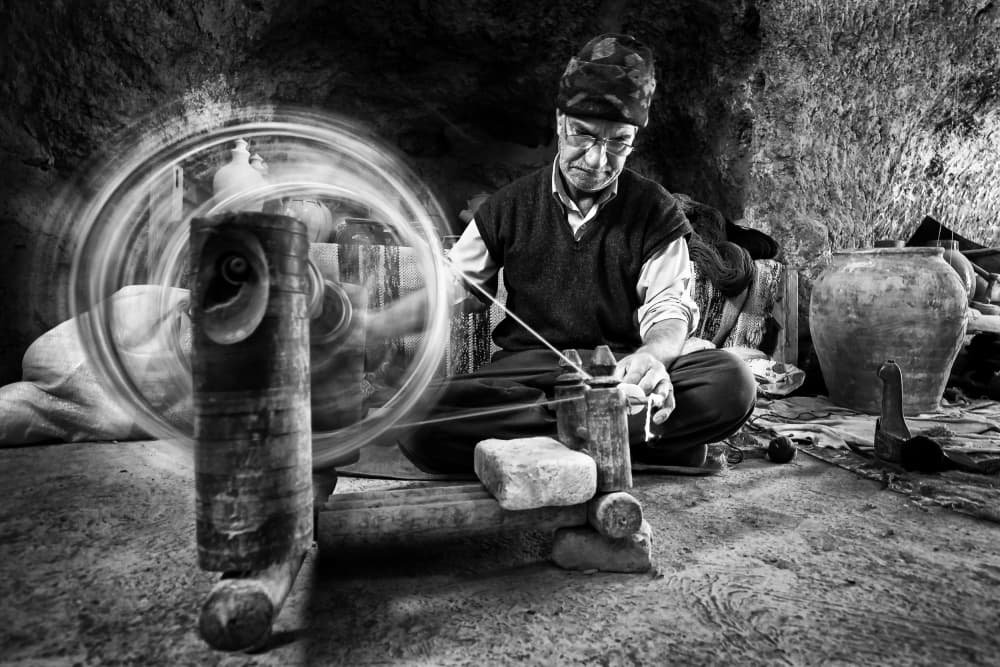 Traditional Spinner at Work by Mohammadreza Momeni — canvas wall art
