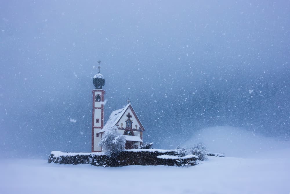 Snowy Alpine Church by James Bian — canvas wall art