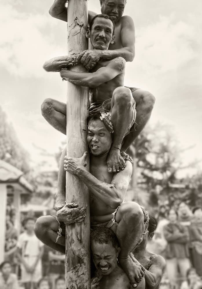 Greasy Pole Climb by Rooswandy Juniawan — canvas wall art