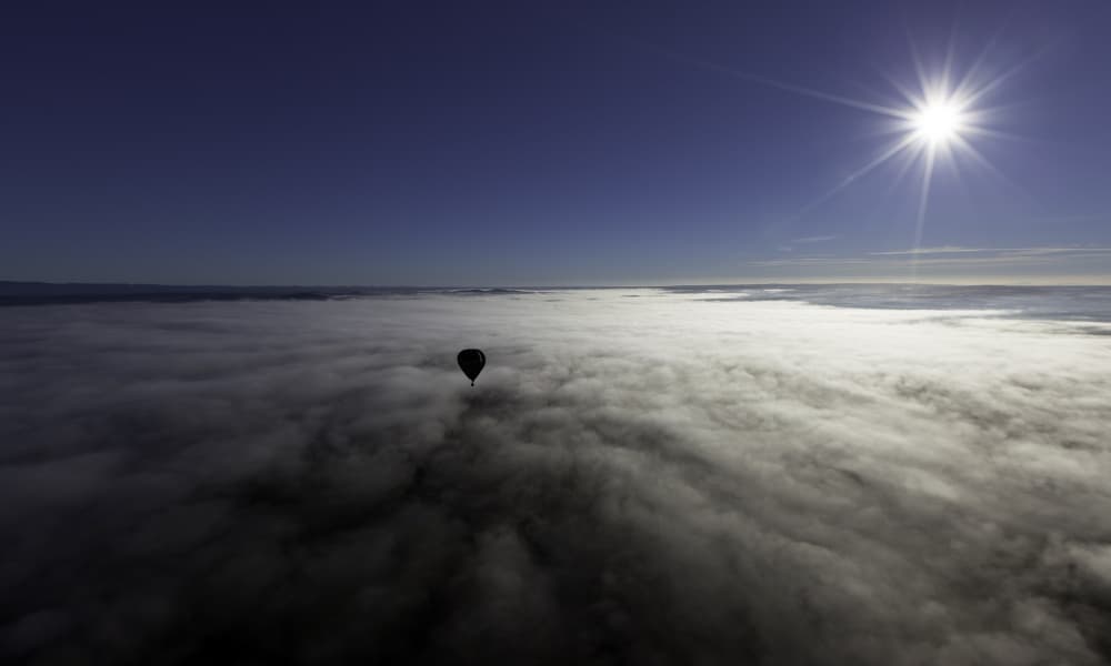 Hot Air Balloon Above Clouds by Jorge Feteira — canvas wall art