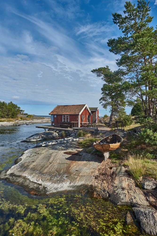 Serene Coastal Boathouse by Geertjan Plooijer — canvas wall art