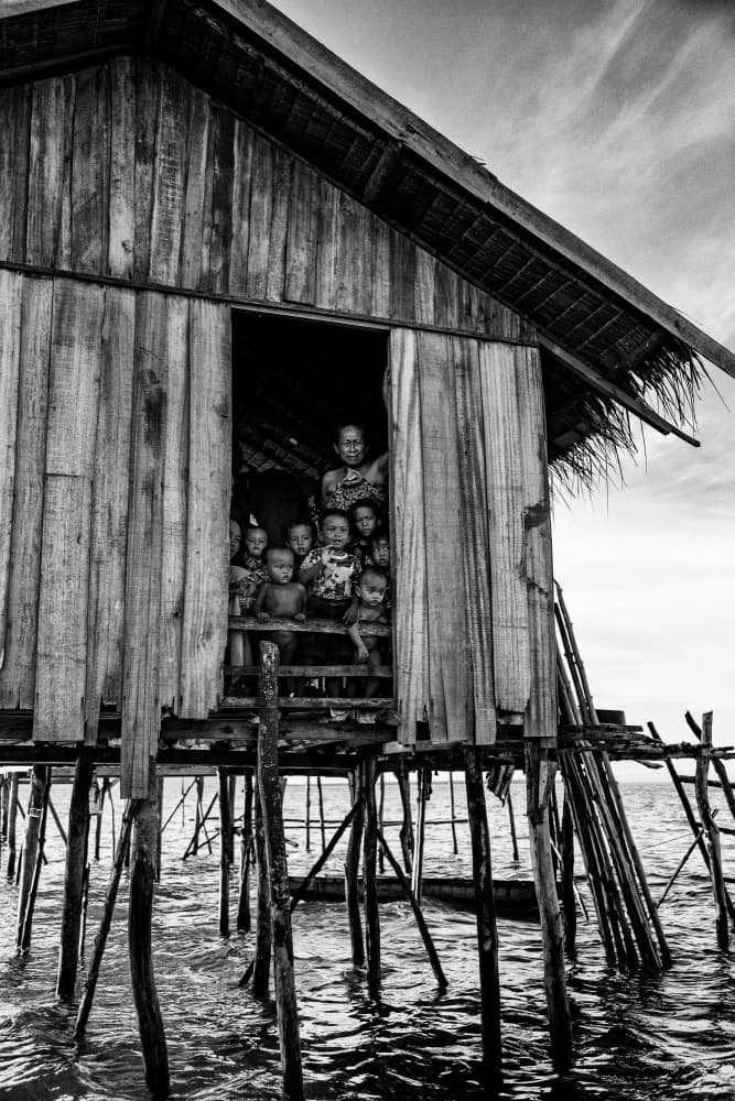 Smiling Stilt House Children by John Yuk Kong Chung — canvas wall art