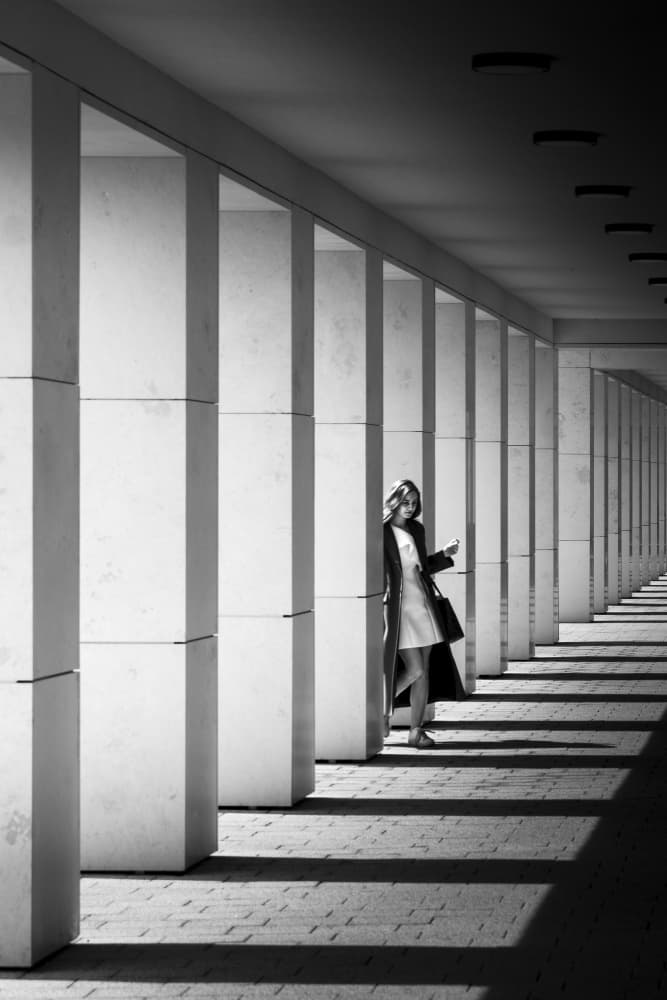 Woman in Shadowed Corridor by Alin Federiga — canvas wall art