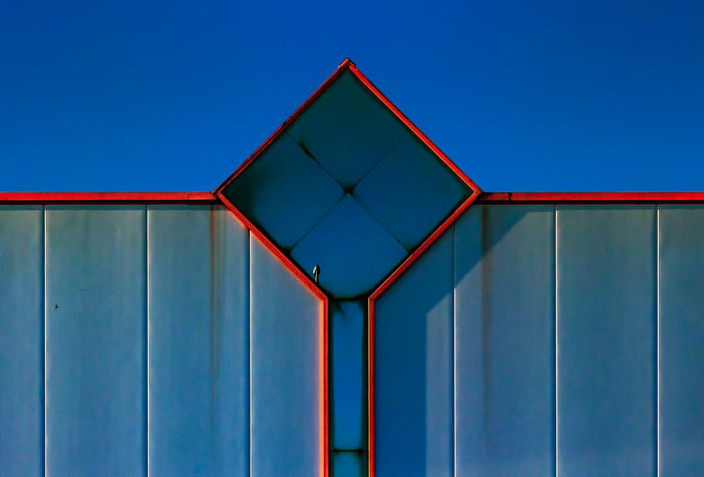 Blue Red Geometric Facade by Jef Van den Houte — canvas wall art