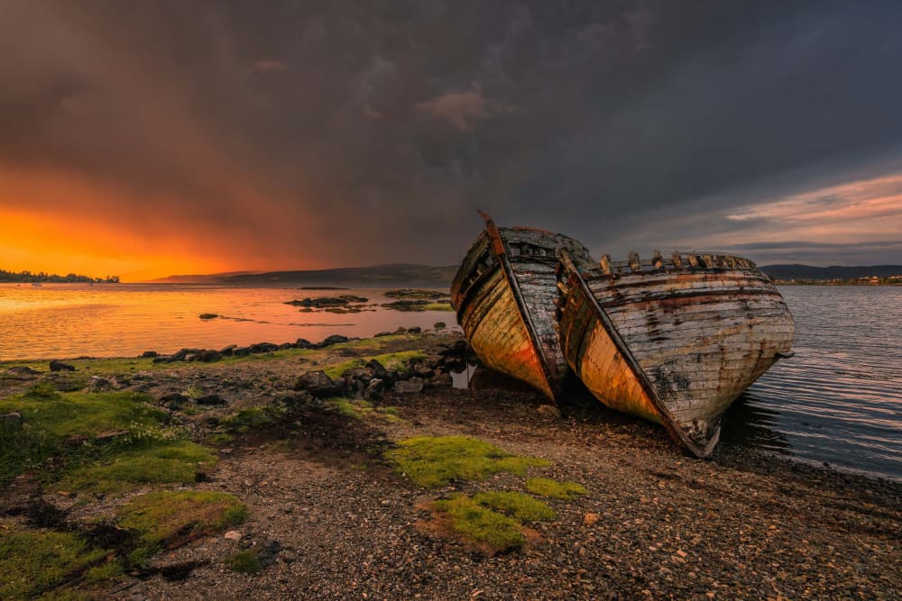 Beached Boats Sunset Drama by Marc Meijlaers — canvas wall art