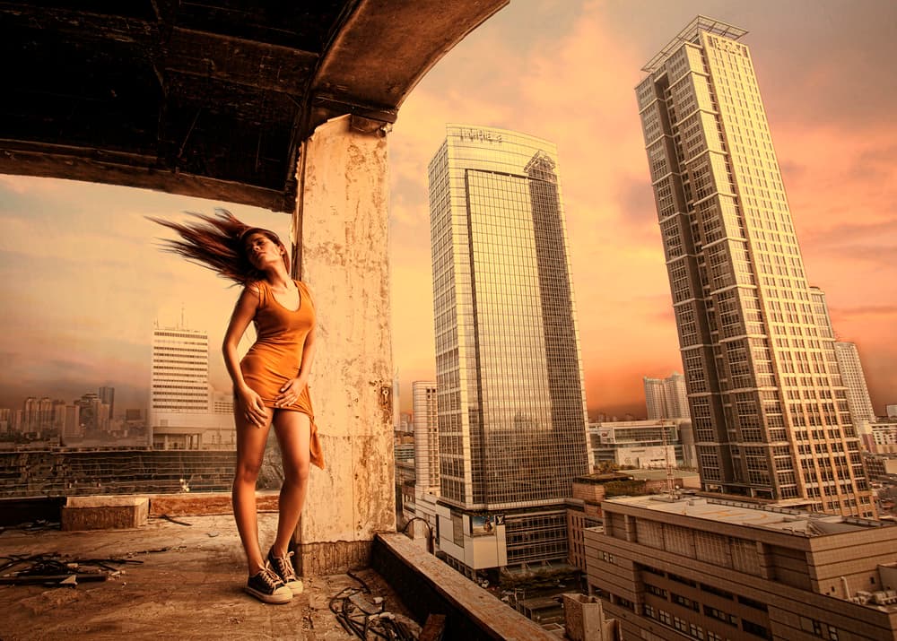 Rooftop City Sunset Woman by Sebastian Kisworo — canvas wall art