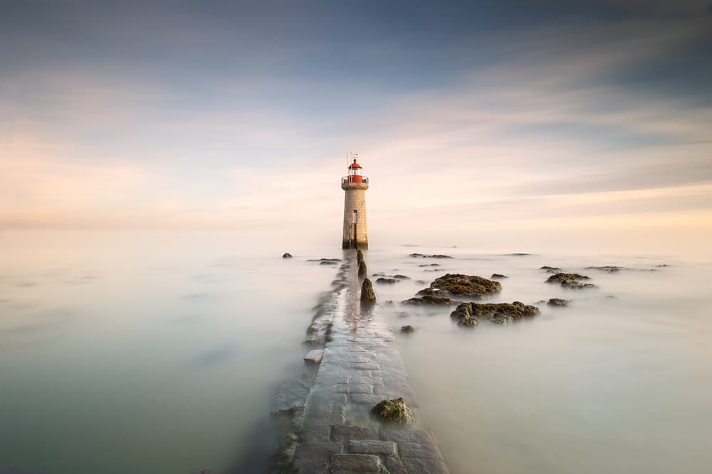 Dreamy Lighthouse Pier by Jose Beut — canvas wall art
