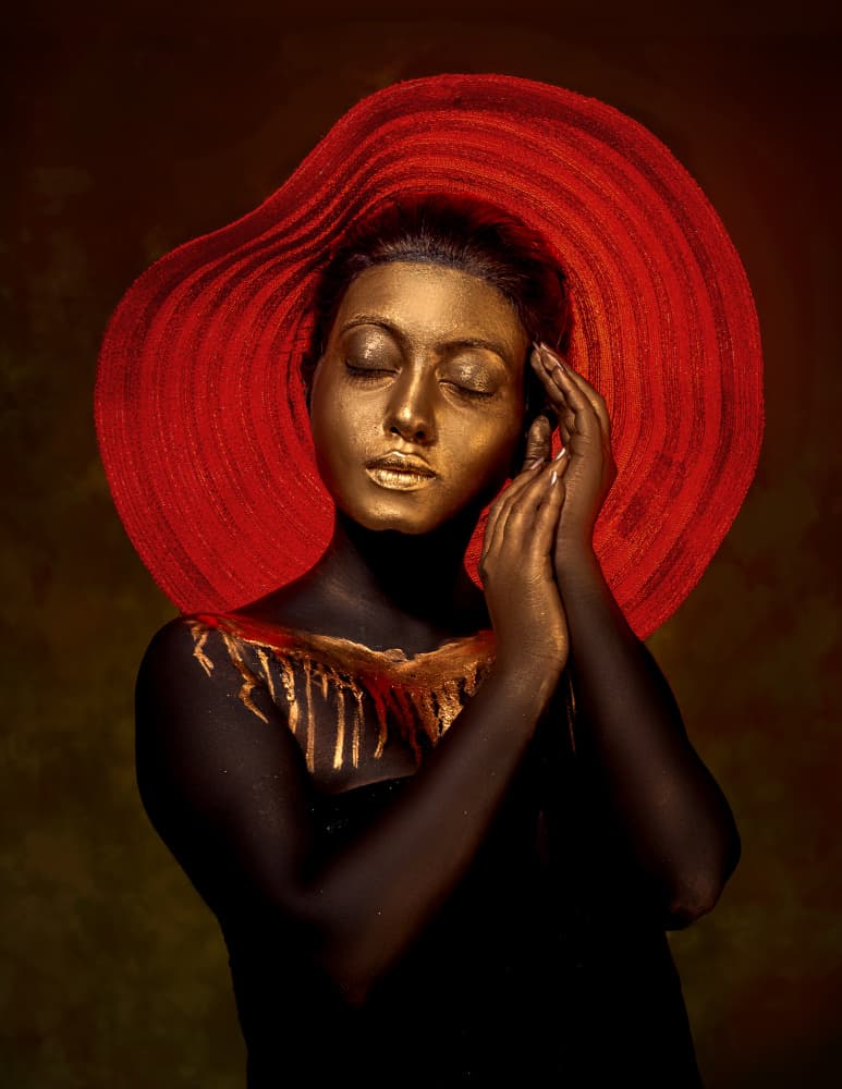 Golden Woman in Red Hat by DEBASISH CHATTOPADHYAY — canvas wall art