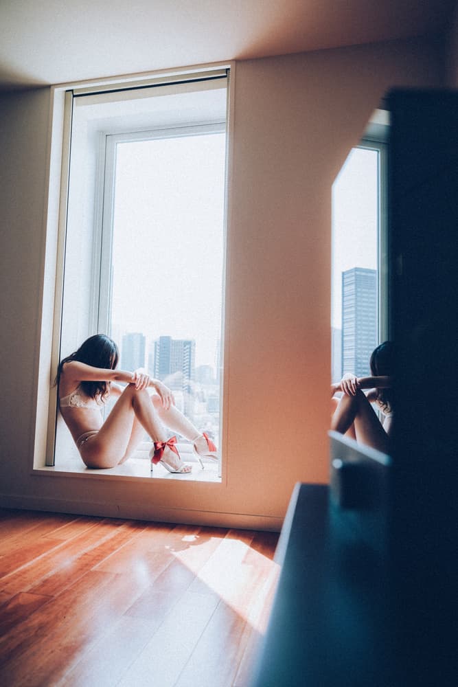 Woman at City Window by Daisuke Kiyota — canvas wall art