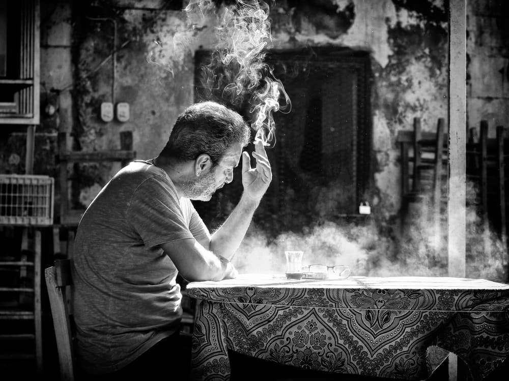 Thoughtful Man Smoking by Gilcan Mete — canvas wall art