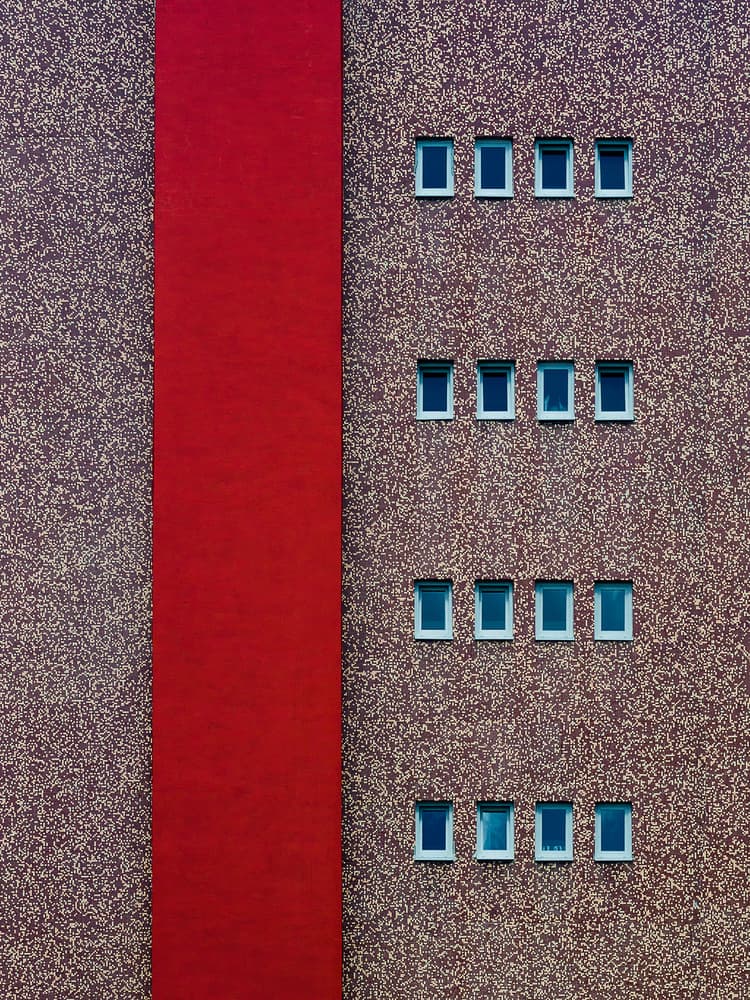Red Building Geometry by Karol Važan — canvas wall art