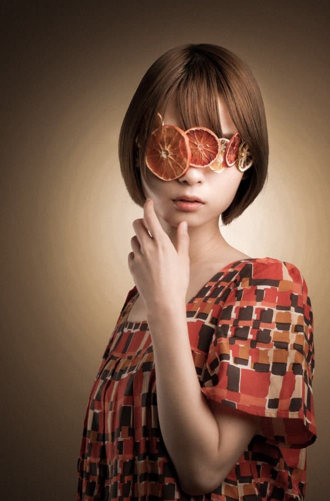 Pensive Woman Orange Slices by Suguru Sumimoto — canvas wall art