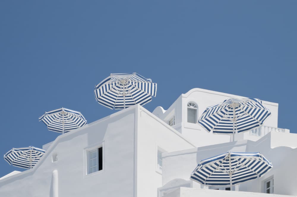Blue Striped Umbrellas by Linda Wride — canvas wall art