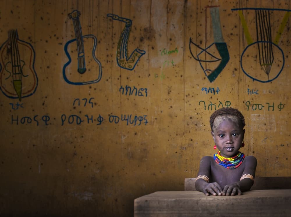 African Classroom Child by Mohammed Al Sulaili — canvas wall art