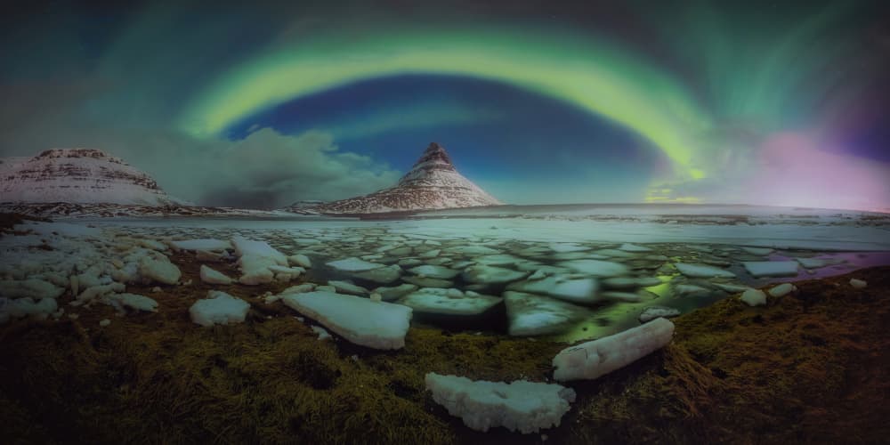 Aurora Over Icy Peaks by Tomás Hueso Marco — canvas wall art
