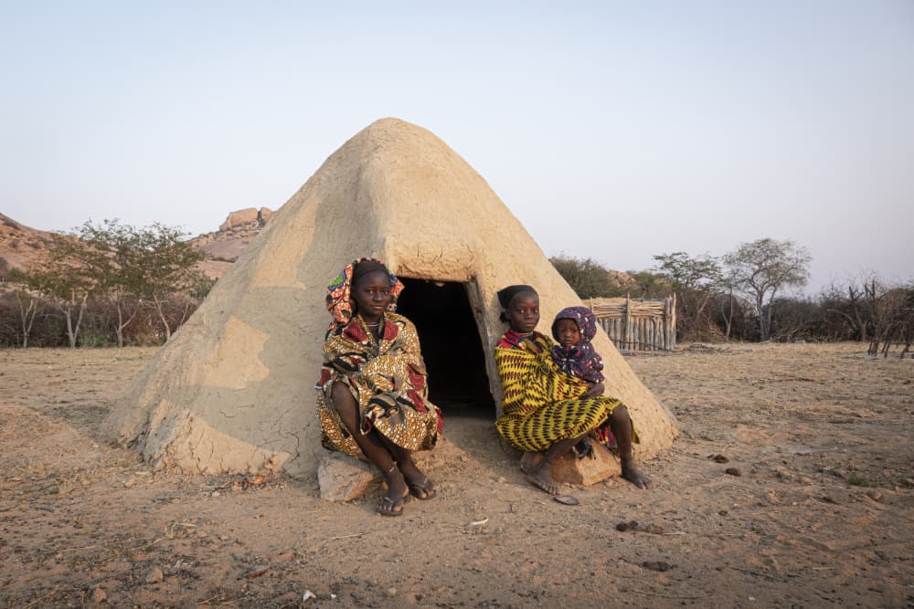 African Girls Mud Hut by Elena Molina — canvas wall art