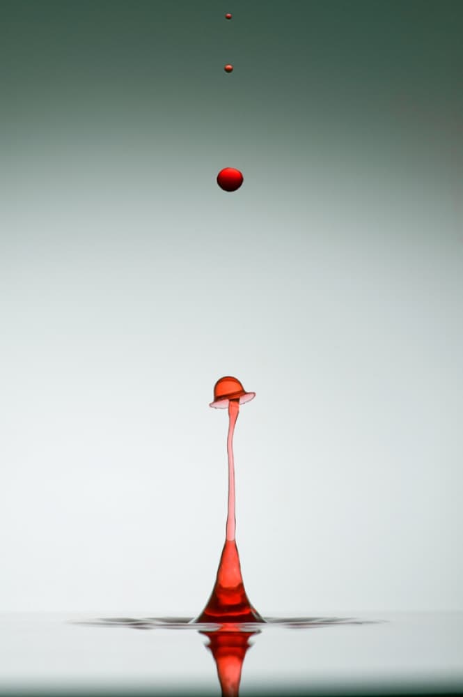 Red Droplet Impact by Veli Aydogdu — canvas wall art