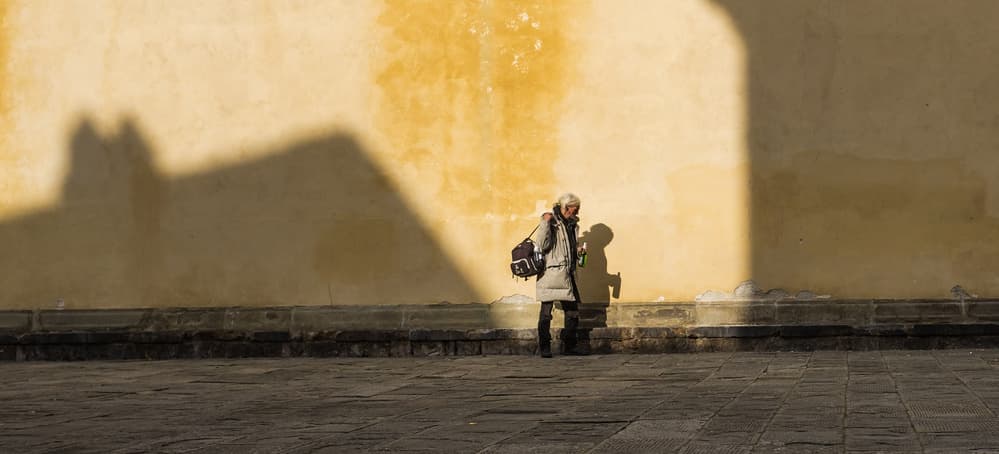 Solitary Figure Strong Shadows by Pawel Majewski — canvas wall art