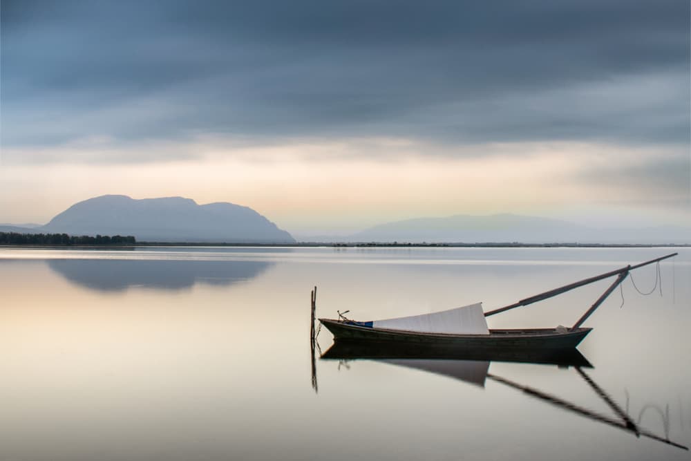Peaceful Lake Boat Reflection by George Digalakis — canvas wall art