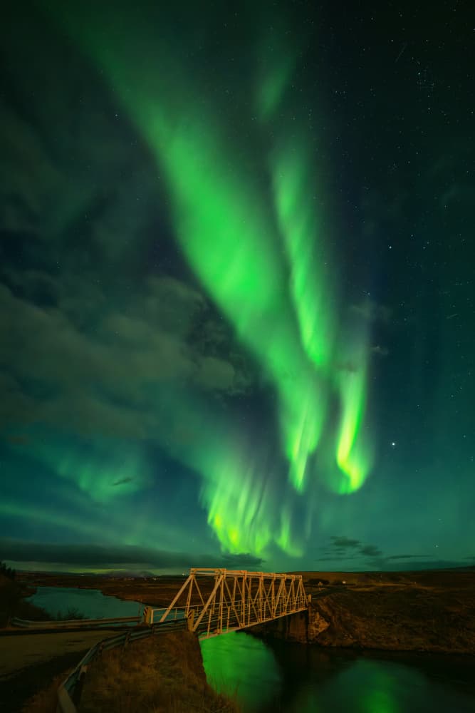 Northern Lights River Glow by Antoni Figueras — canvas wall art