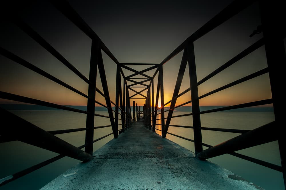 Dramatic Sunset Pier by Wisam Hassan — canvas wall art