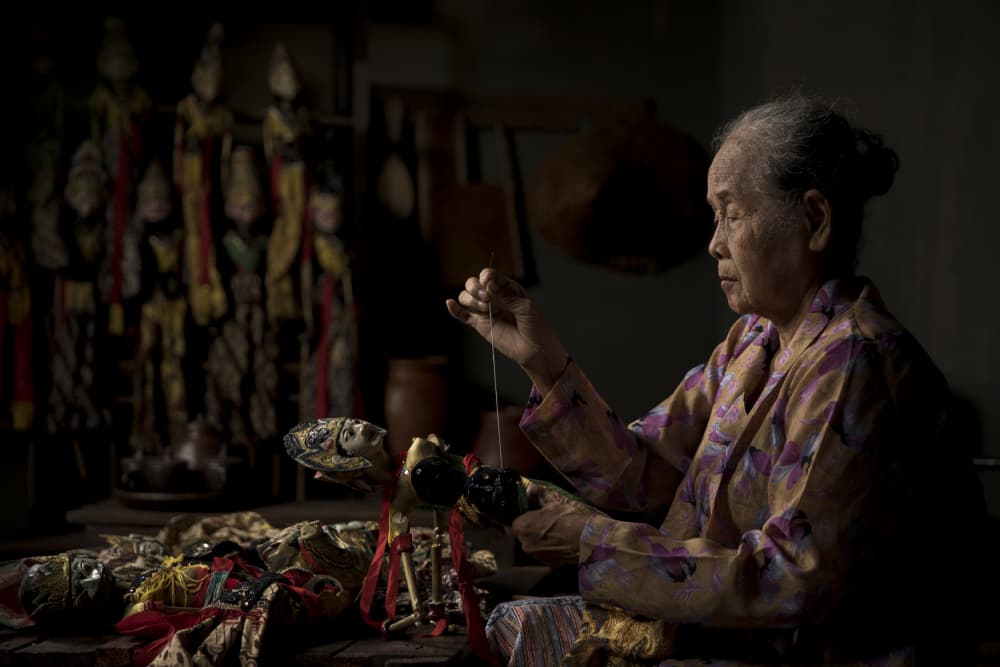 Indonesian Puppet Maker by Sita Gramich — canvas wall art