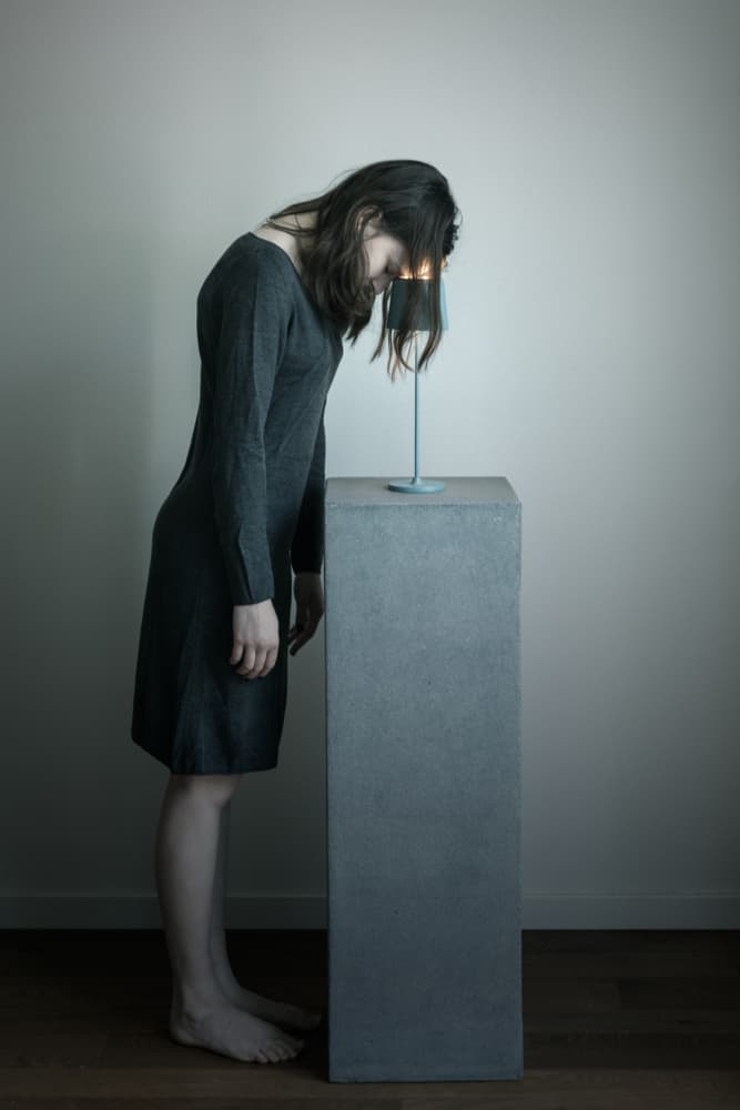 Pensive Woman Soft Glow by Mirjam Delrue — canvas wall art