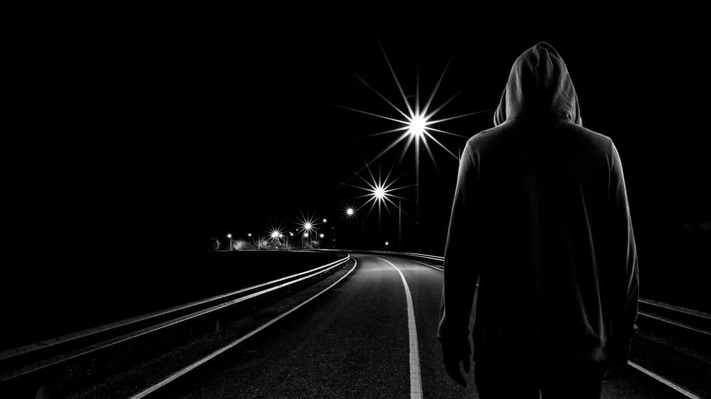 Hooded Figure Night Road by Woraphon Banchobdi — canvas wall art