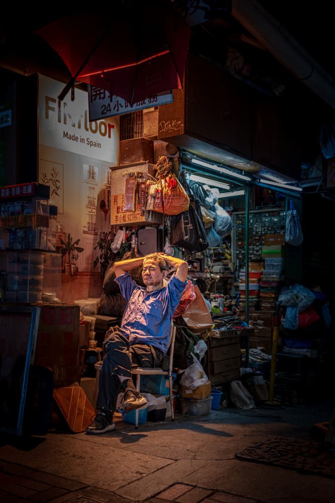 Man Resting City Street by Alan Kwang — canvas wall art