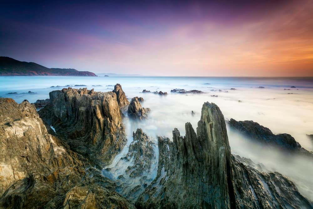 Misty Ocean Rocks by Daniele Atzori — canvas wall art