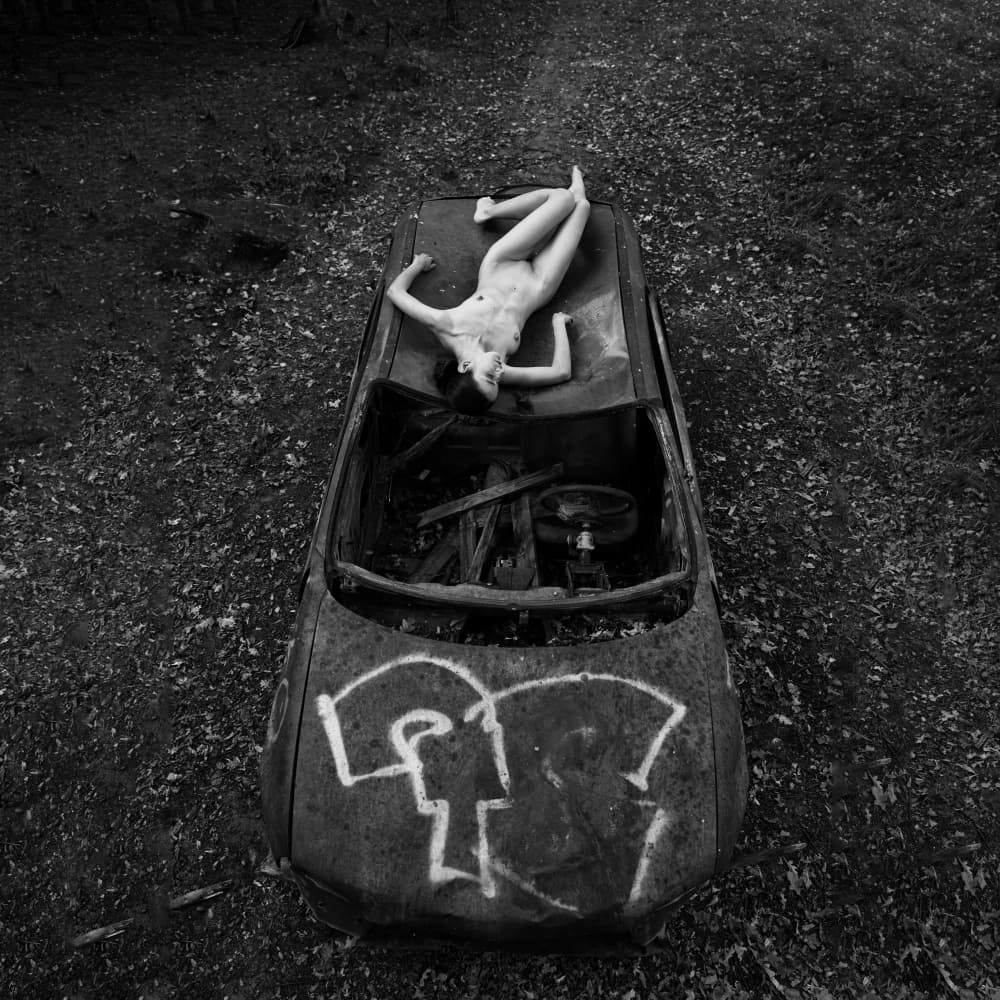 Nude on Abandoned Car by Lukas Kaminski — canvas wall art