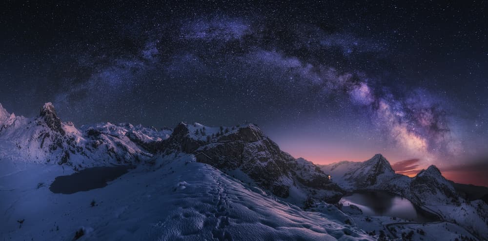 Milky Way Over Snowy Peaks by Carlos F. Turienzo — canvas wall art