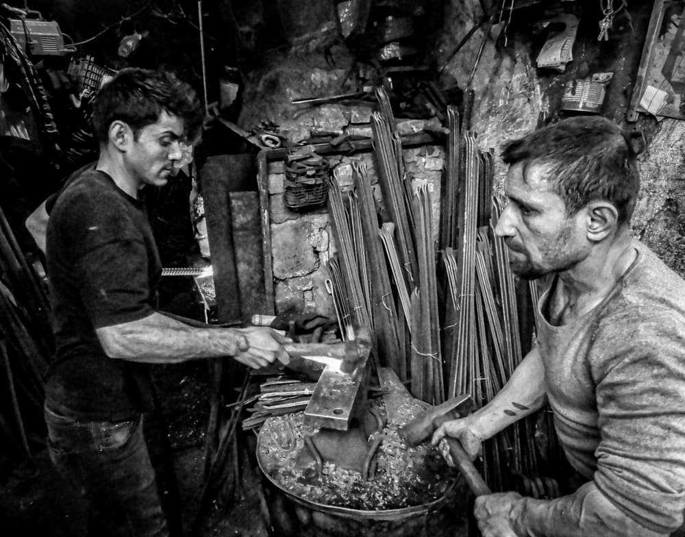 Working Blacksmiths by Bashar Alsofey — canvas wall art