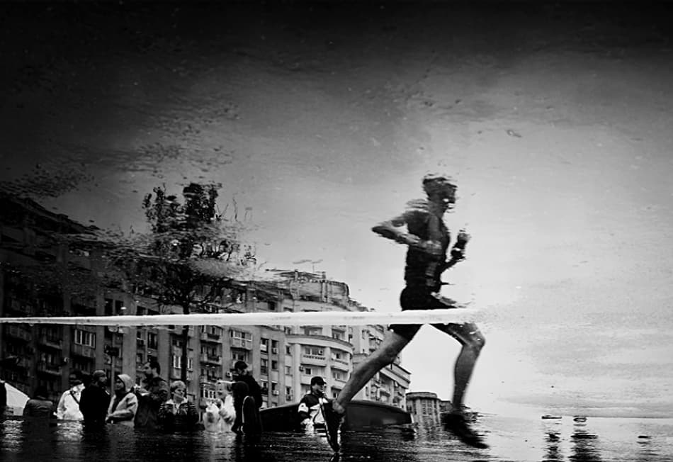 City Runner Reflection by Mirela Momanu — canvas wall art