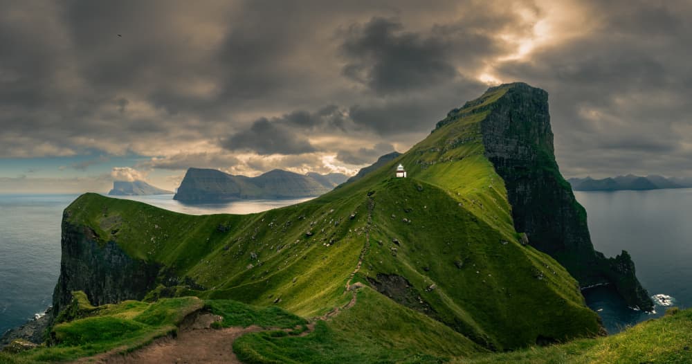 Dramatic Cliffside Lighthouse by Haim Rosenfeld — canvas wall art