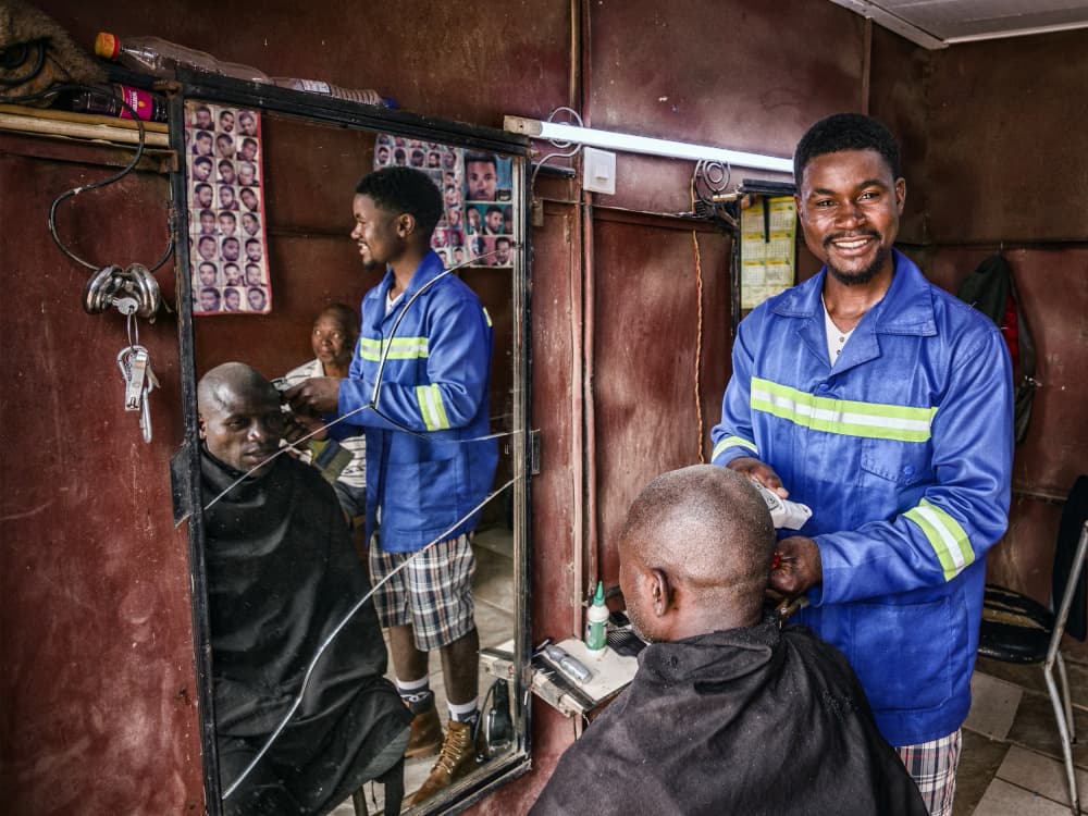 Smiling Barber at Work by Pavol Stranak — canvas wall art