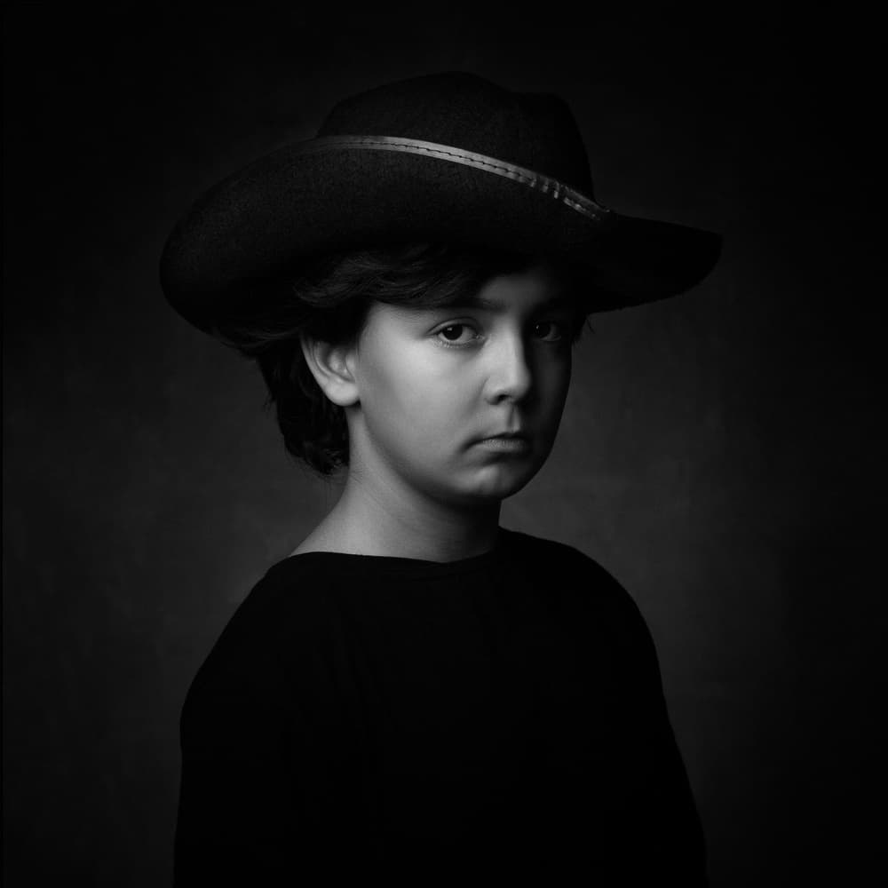 Young Cowboy Portrait by Mehdi Mokhtari — canvas wall art