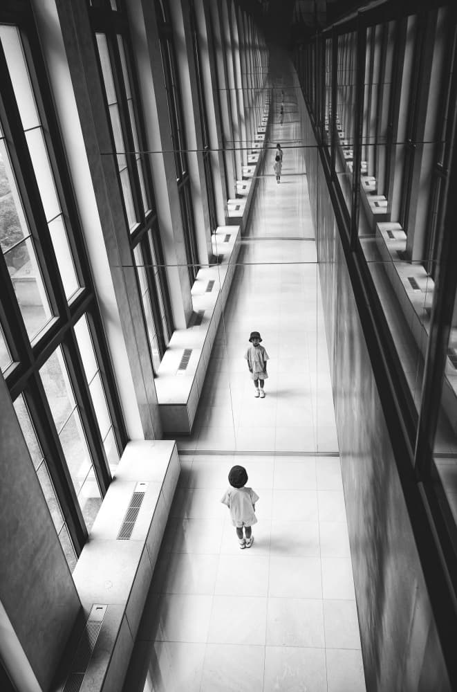 Children In Modern Corridor by Bong Goo Kang — canvas wall art