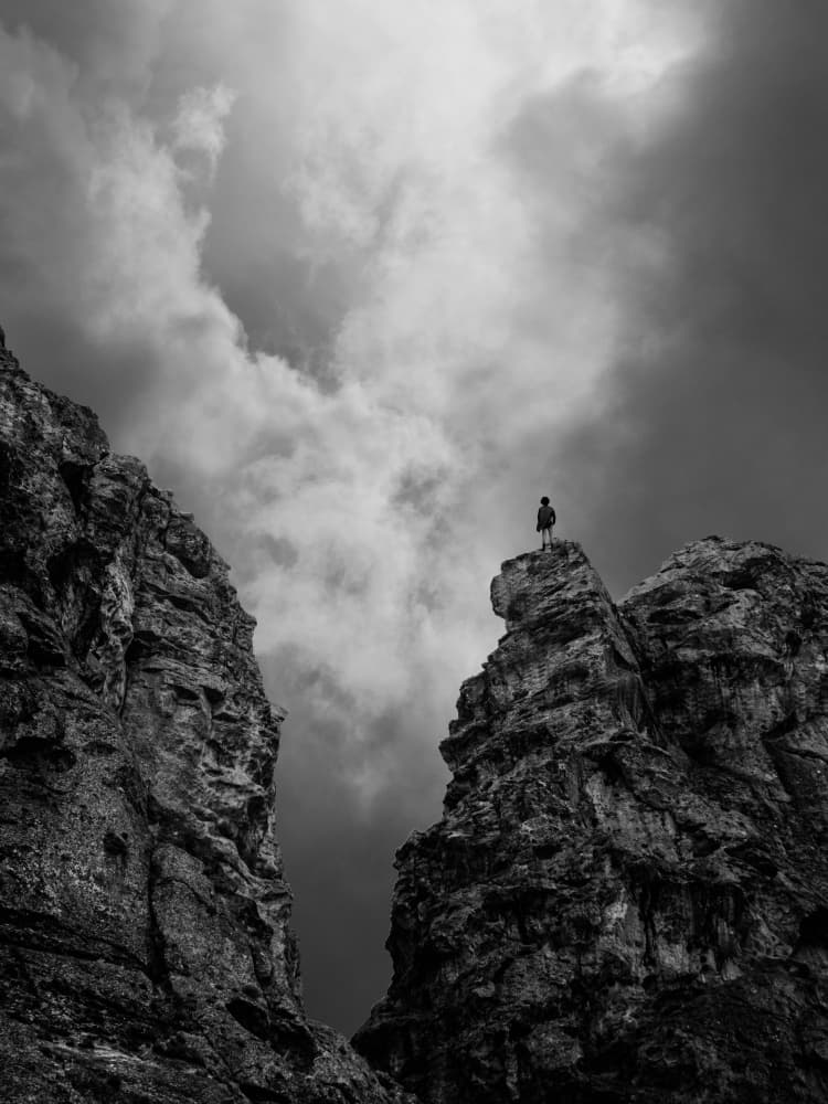 Lone Figure Mountain Peak by Saba Noori — canvas wall art