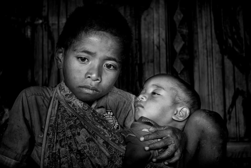 Young Sibling's Tender Hold by Joao Galamba — canvas wall art