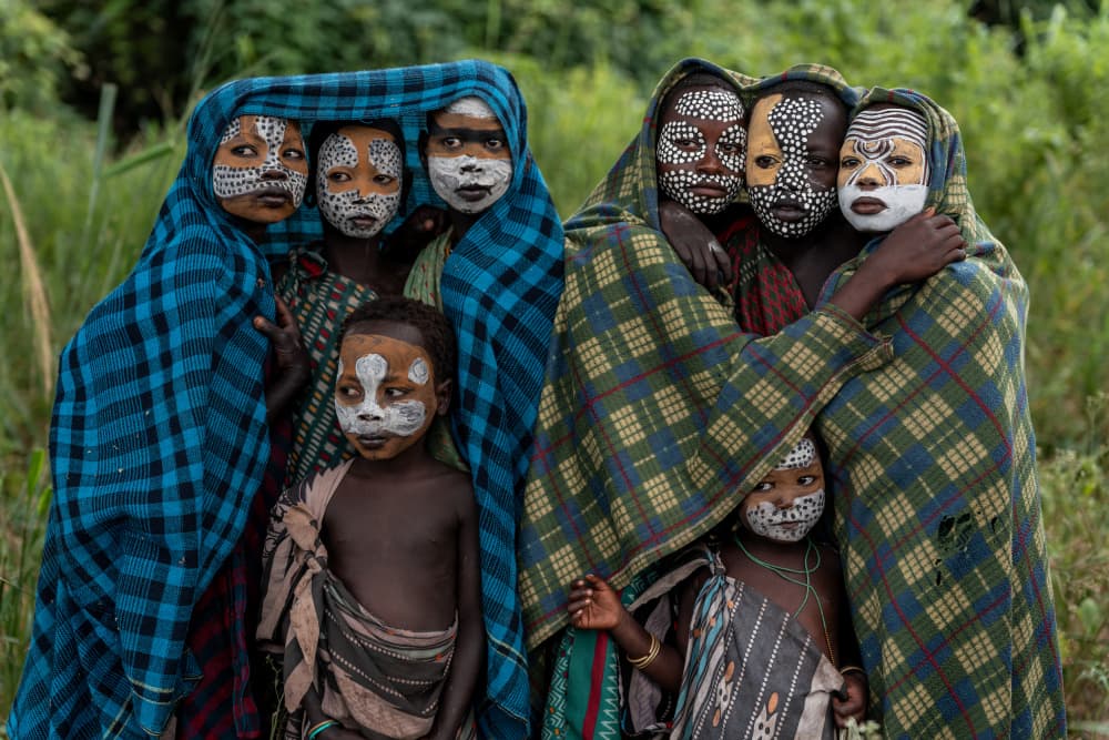Painted Tribal Faces by HuongHoang — canvas wall art