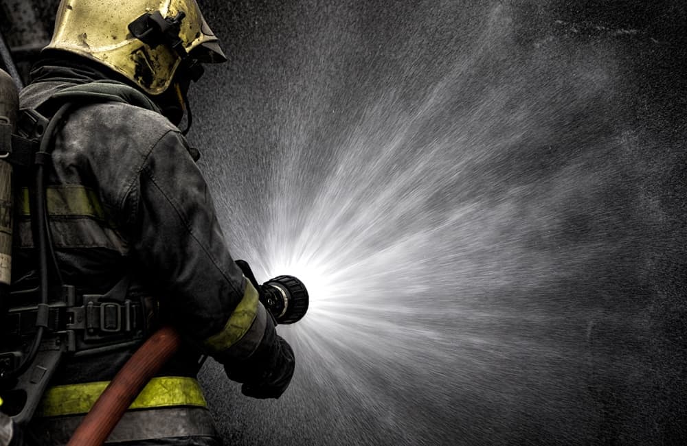 Firefighter Water Spray by Jorge Feteira — canvas wall art
