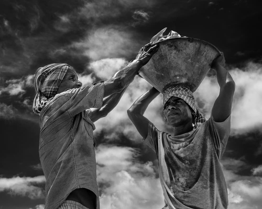 Carrying Daily Burdens by JOYRAJ SAMANTA — canvas wall art