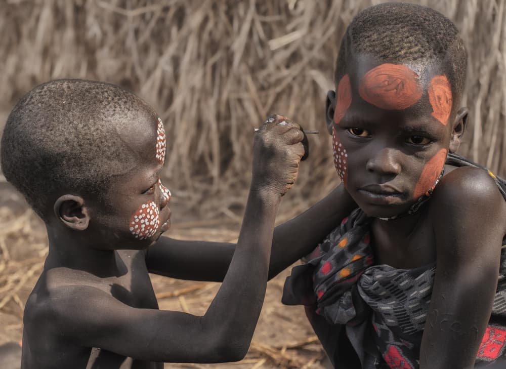 Tribal Children Painting Faces by Yang Jiao — canvas wall art