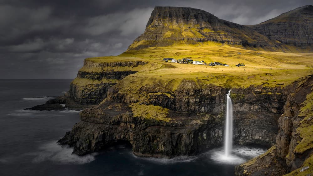 Múlafossur Waterfall Village by Mozart Chan — canvas wall art