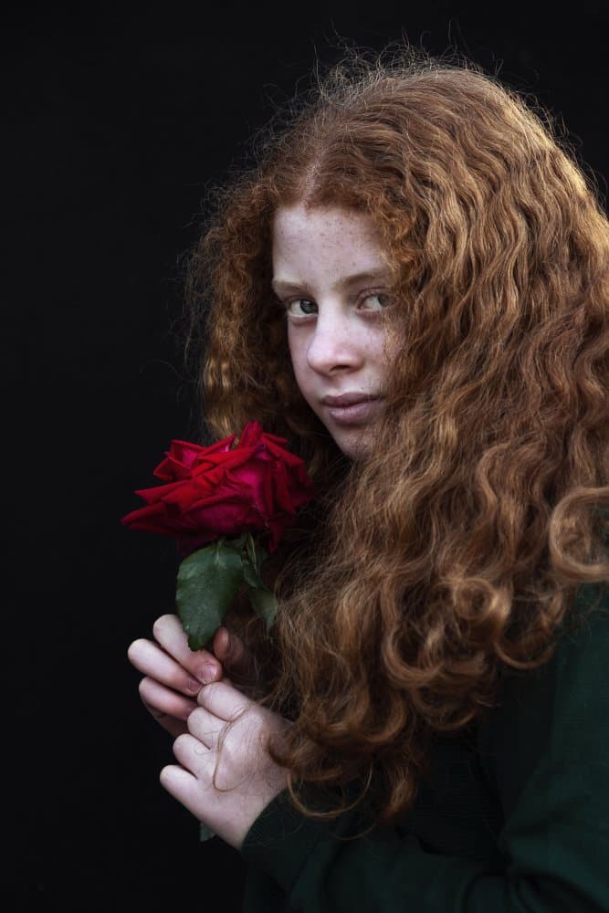 Redhead Girl with Rose by Emel Sefer — canvas wall art